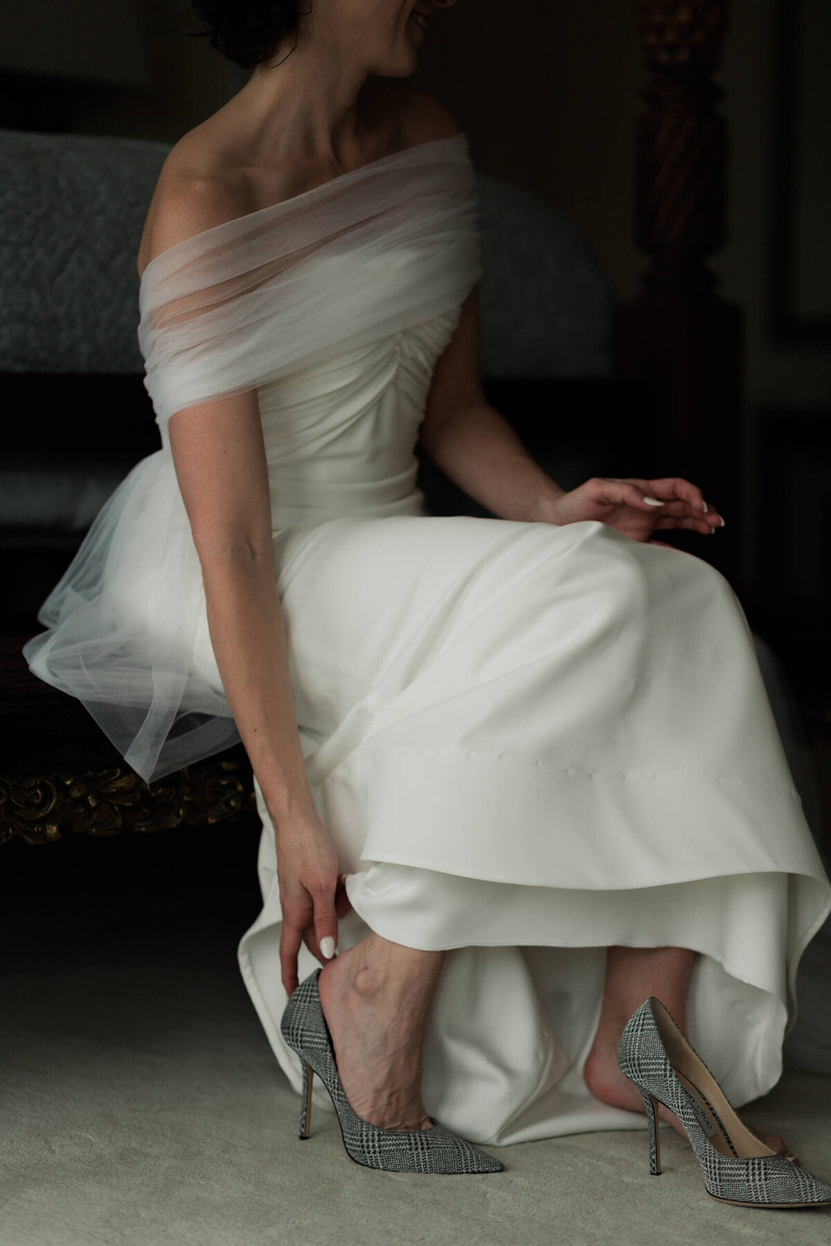 bride puts on her shoes at The Peach Orchard in Houston Texas by Swish and Click Photography