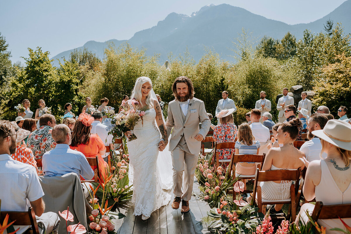 Bride and groom walk down the aisle at Cheekye Ranch during their Squamish wedding ceremony