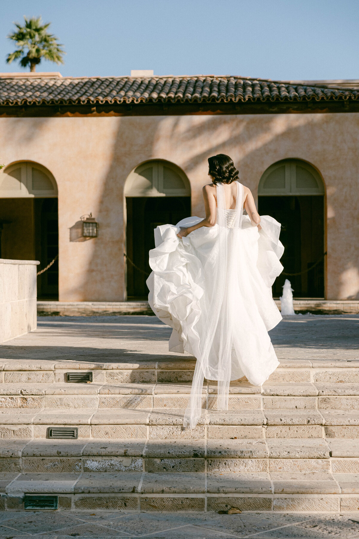 Bride’s elegant wedding dress details, captured at Royal Palms Resort, Scottsdale, Arizona, showcasing fine craftsmanship and timeless style.