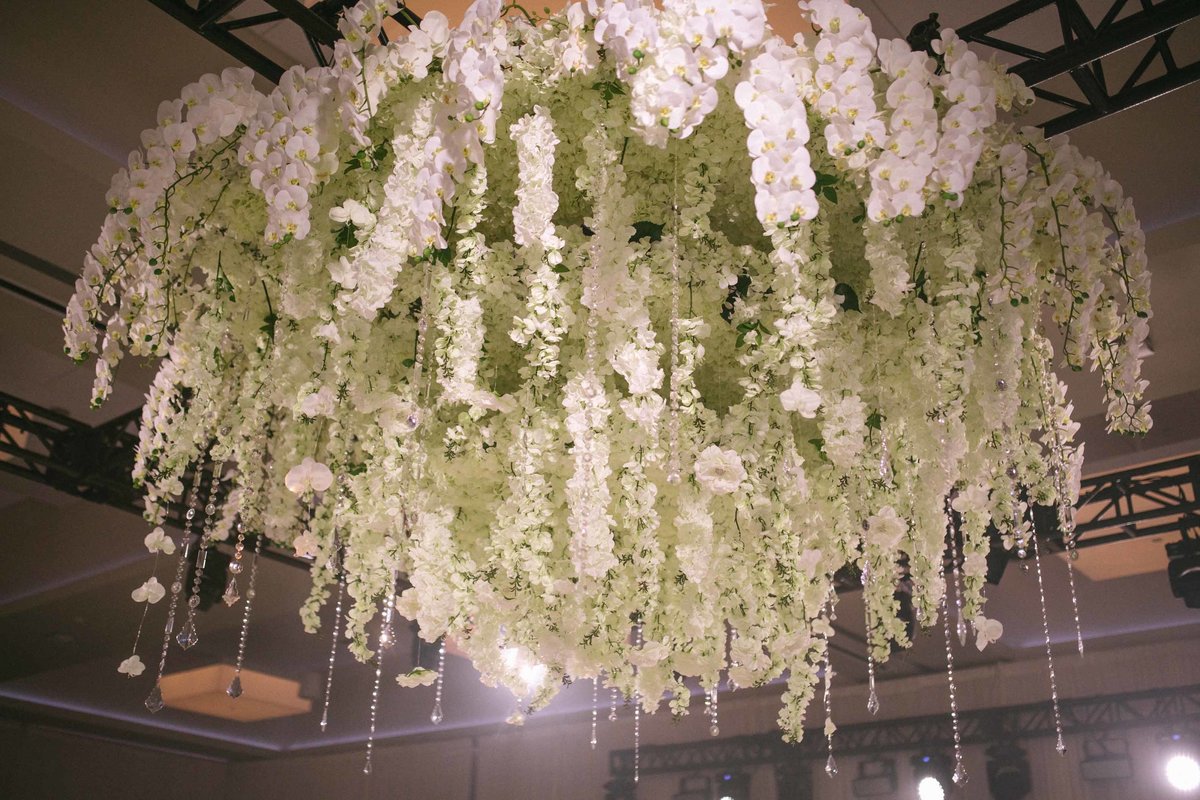White orchid and delphinium  hanging floral installation chandelier