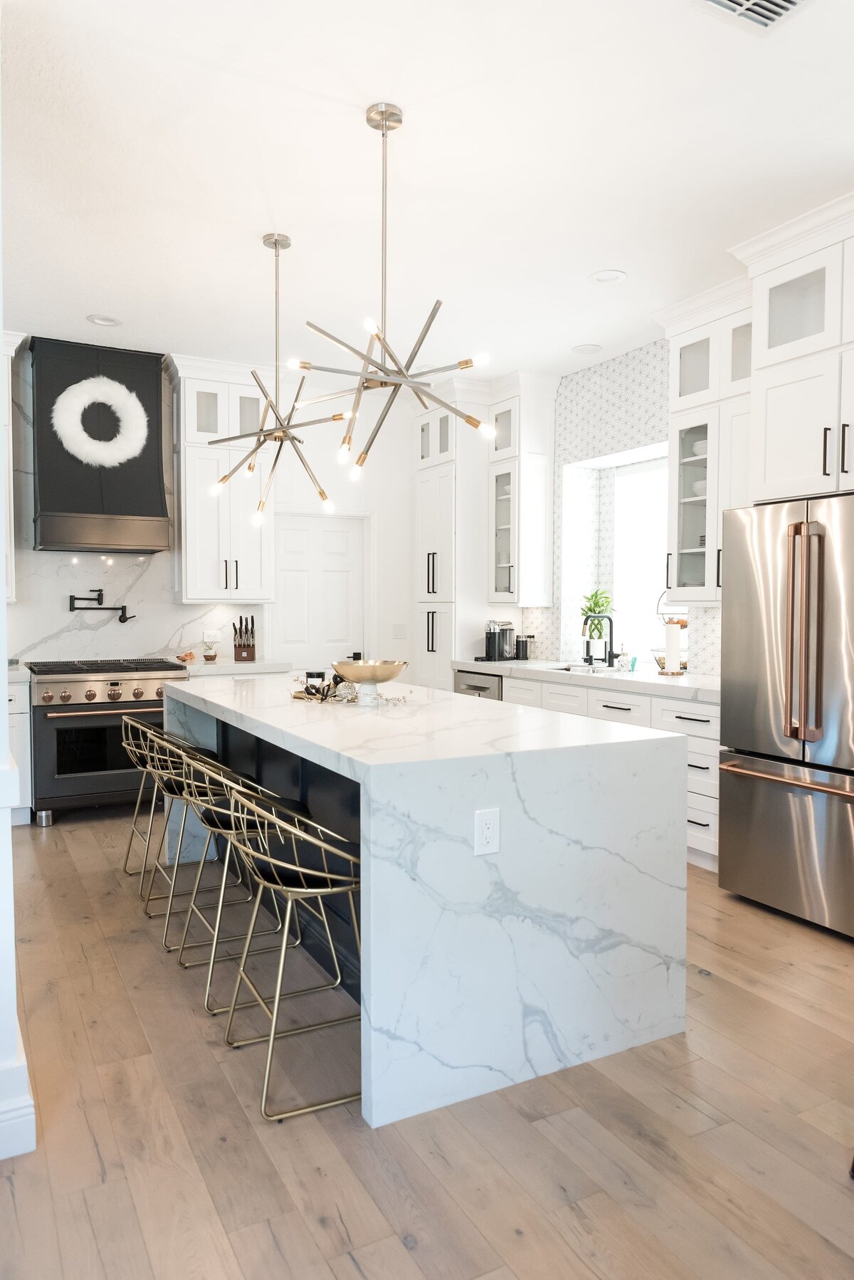 dewine design orlando interior designer modern lakehouse kitchen with marble waterfall island