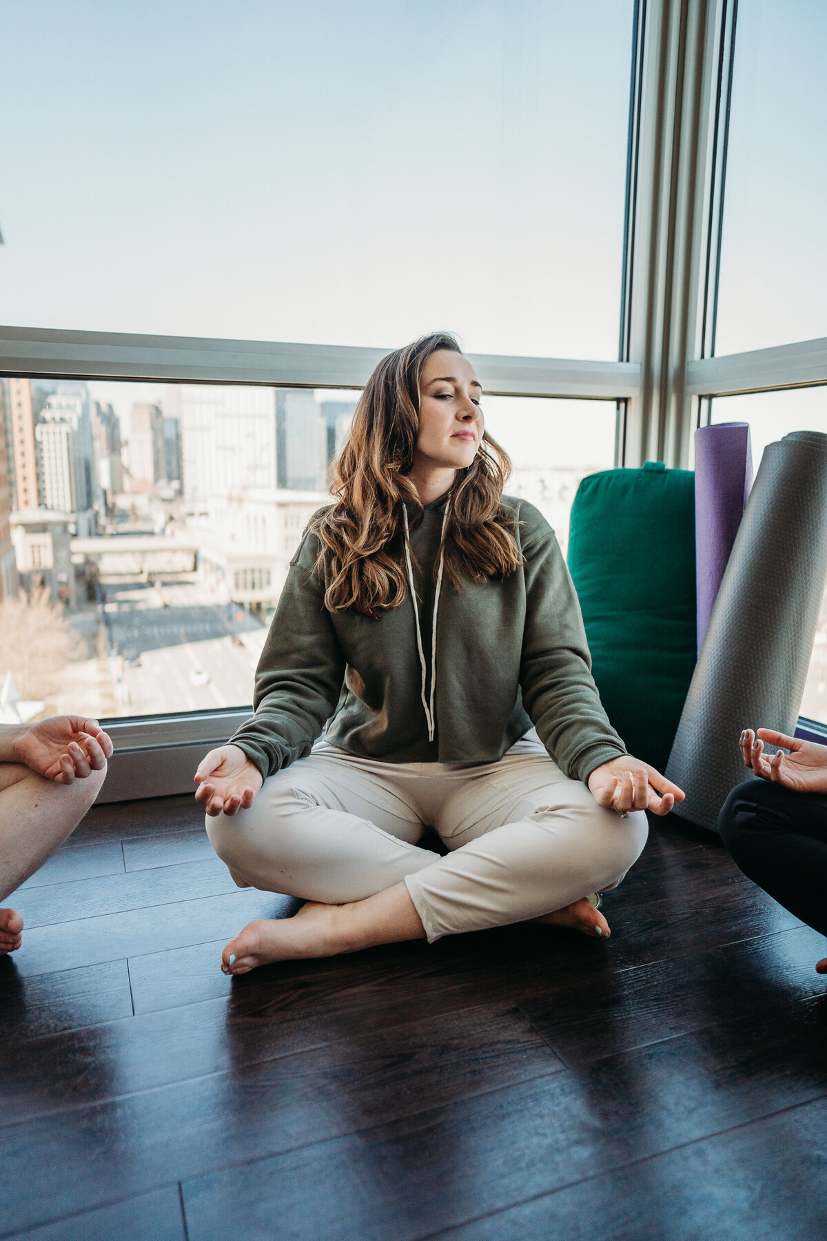 yoga sits in meditation in class