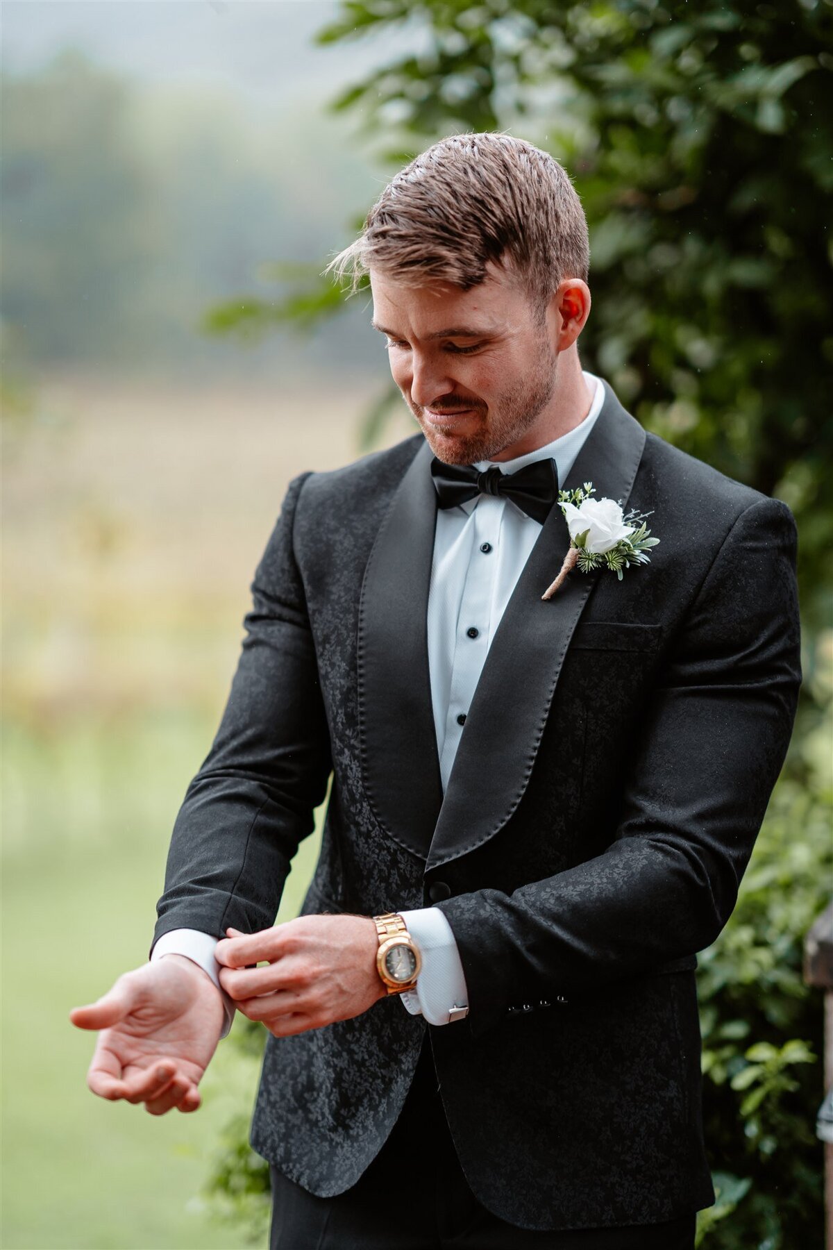 Dapper groom exuding timeless elegance, ready to charm his way into your heart on the most special day of his life.
