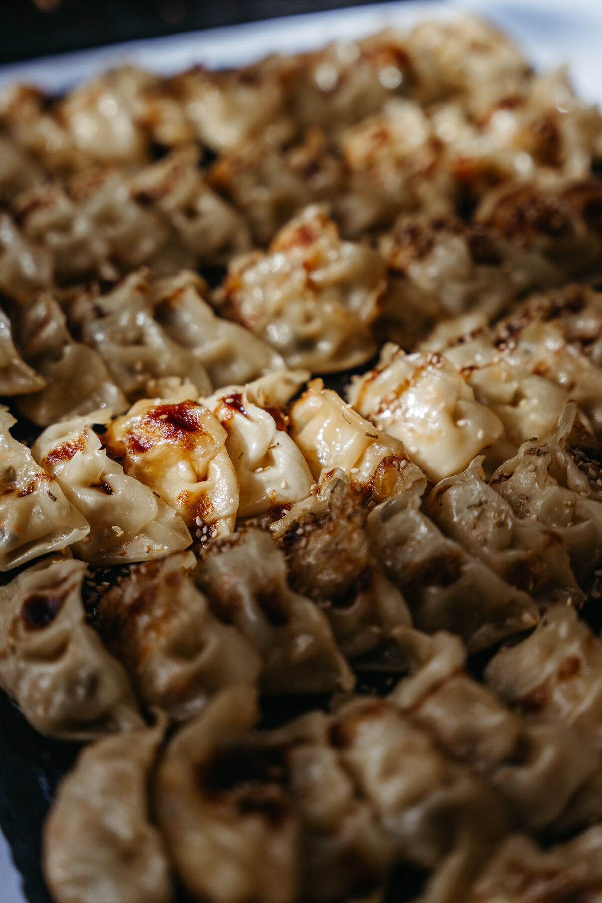 Tray of grilled vegan dumplings at wedding reception
