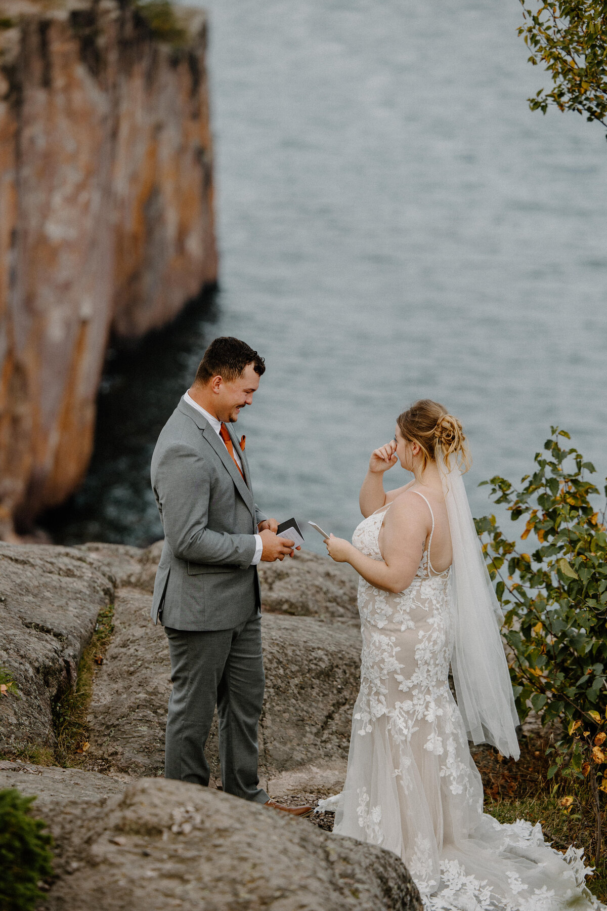 Bride and Groom exchanging vows privately on the cliffs above Lake Superior at Palisade Head for their North Shore MN Elopement.