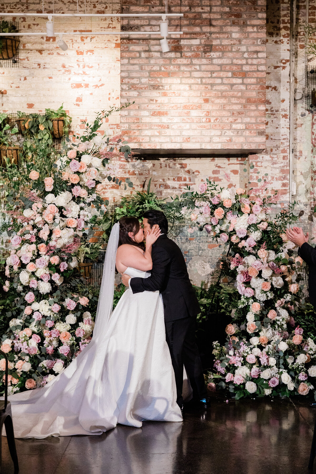 Bride and groom share their first kiss 