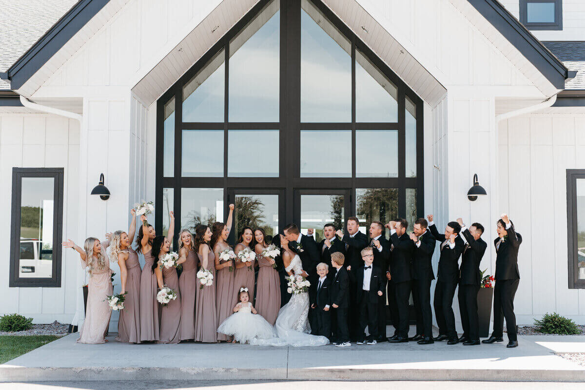 Bridal party in front of doors by chicago wedding planners