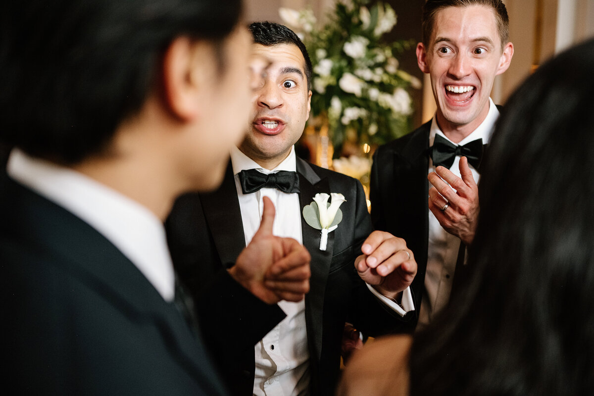 grooms at wedding reception