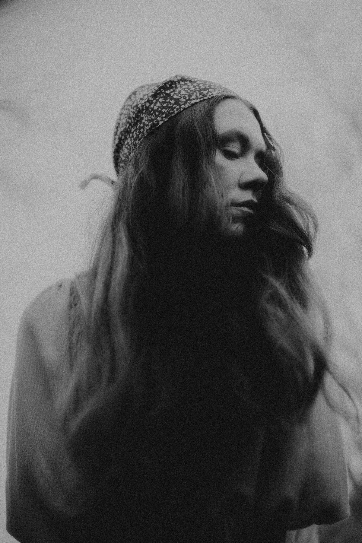 Photo of photographer in black and white using a bold lightroom preset.