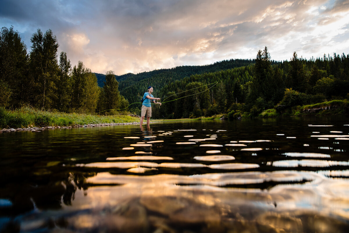 portrait-senior-highschool-flyfishing-clouds-river-kingston