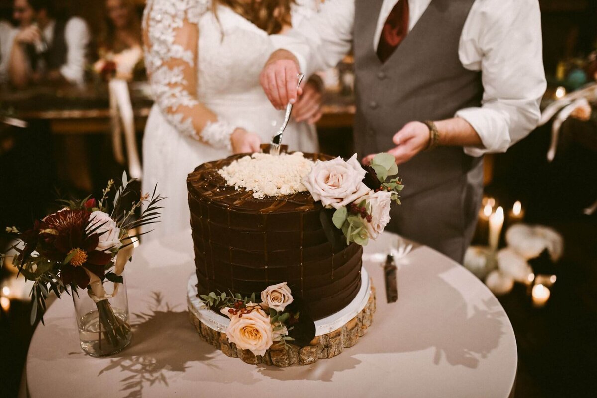 megan lang wedding - cake with flowers