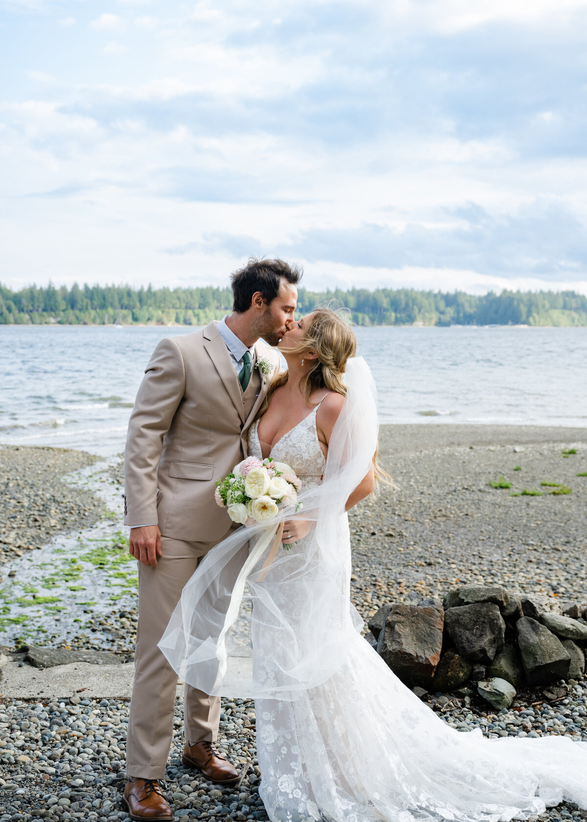 olympic peninsula beach wedding portraits bride and groom after ceremony in the sand