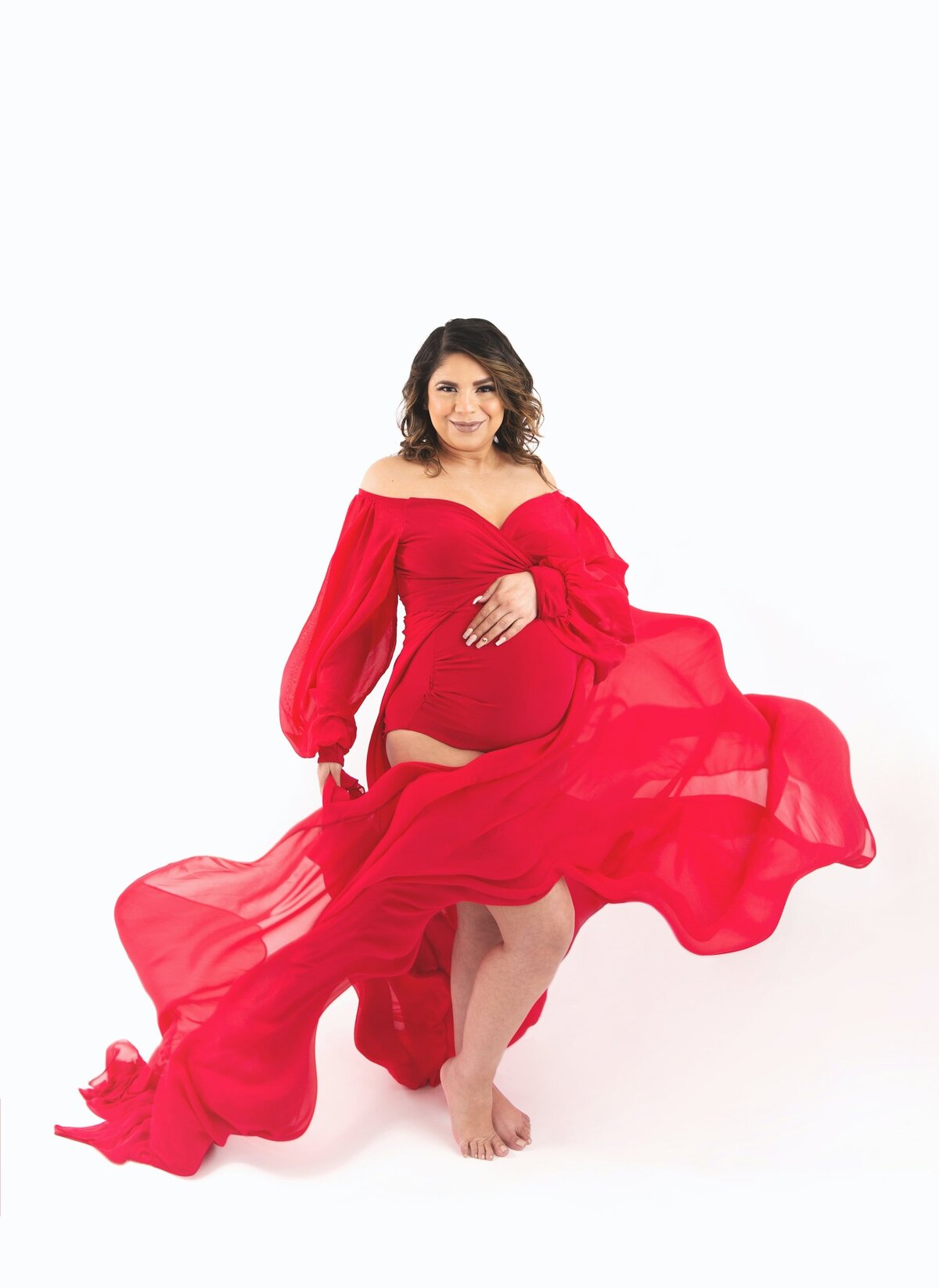 Maternity studio shoot with flowy red dress