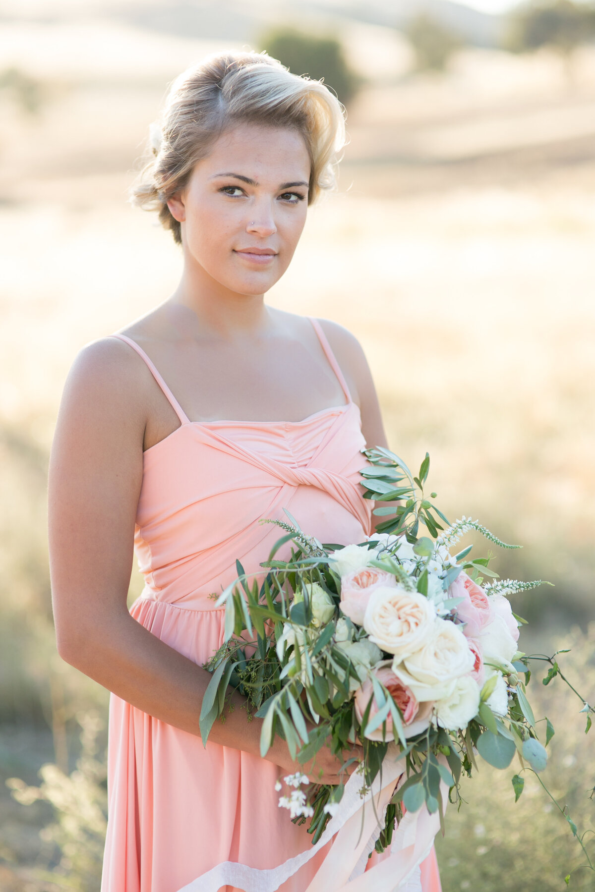 Bridesmaid in peach dress with peach makeup