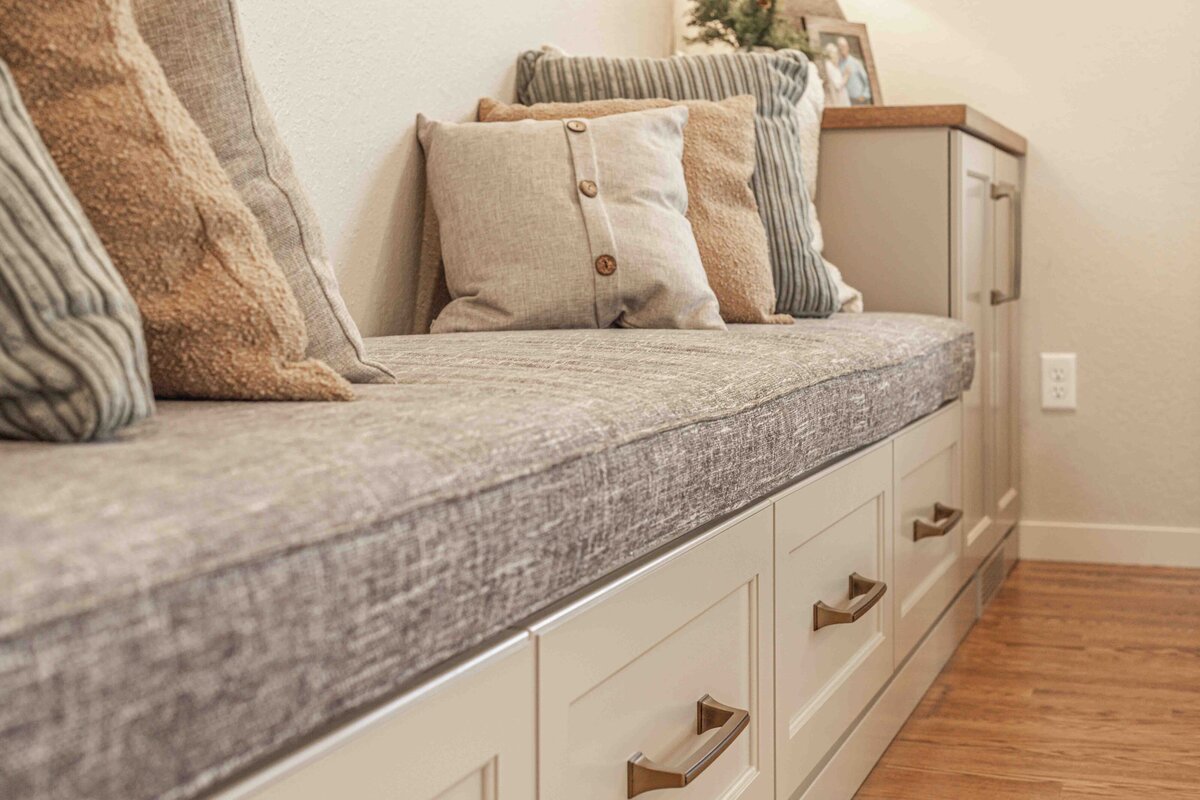 pillows on couch with storage underneath