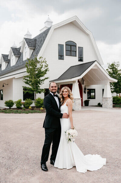 Bride and groom in front of wedding venue planned by luxury wedding planner chicago