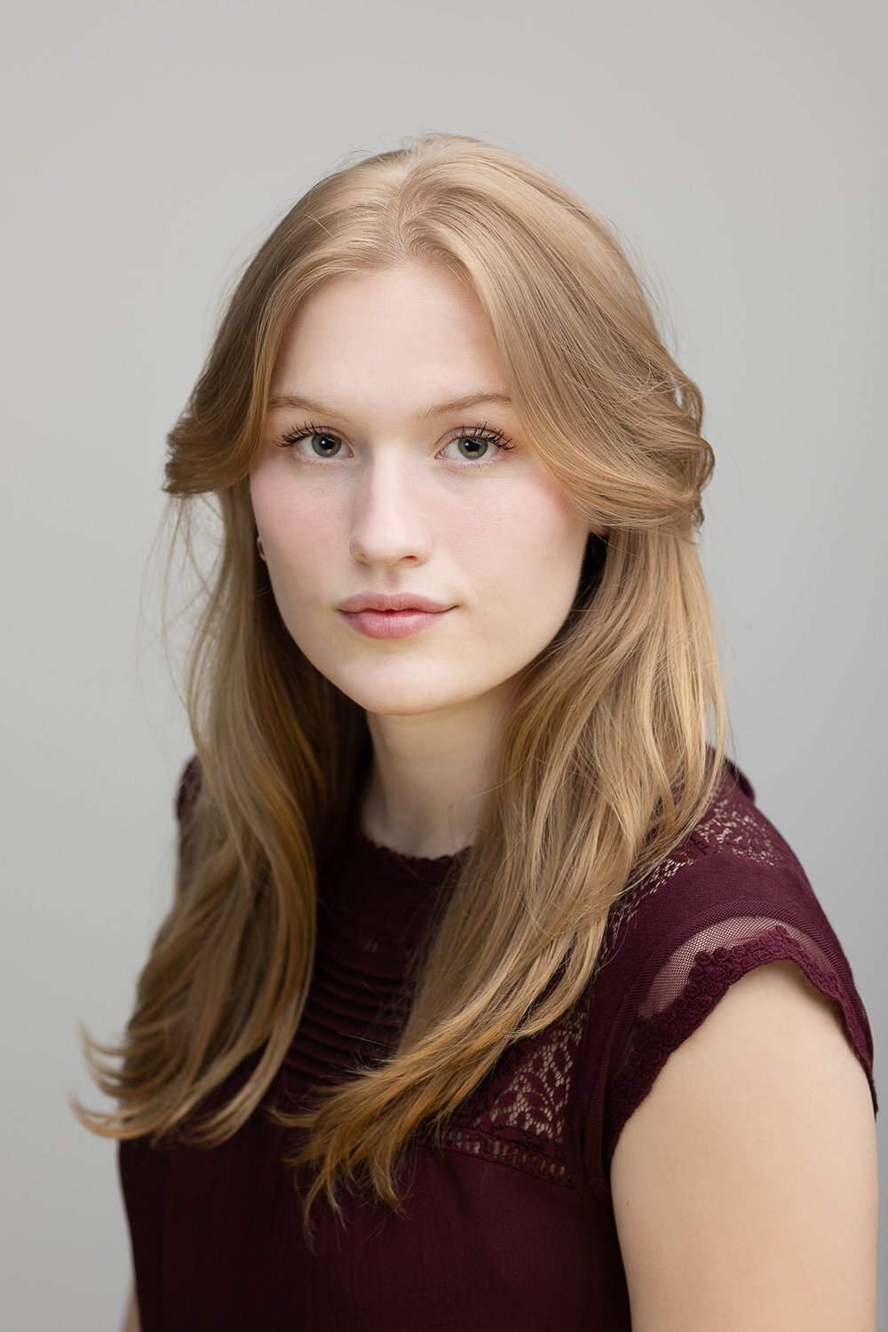 Actor with long hair  looking at the camera