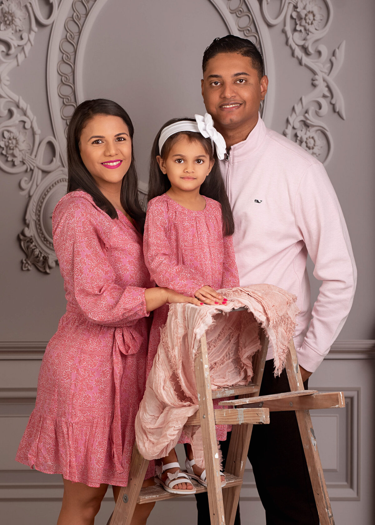 Sophisticated family portrait with parents and children dressed in formal attire, captured in Overland Park, Kansas. A perfect setup for families seeking polished and professional family photography