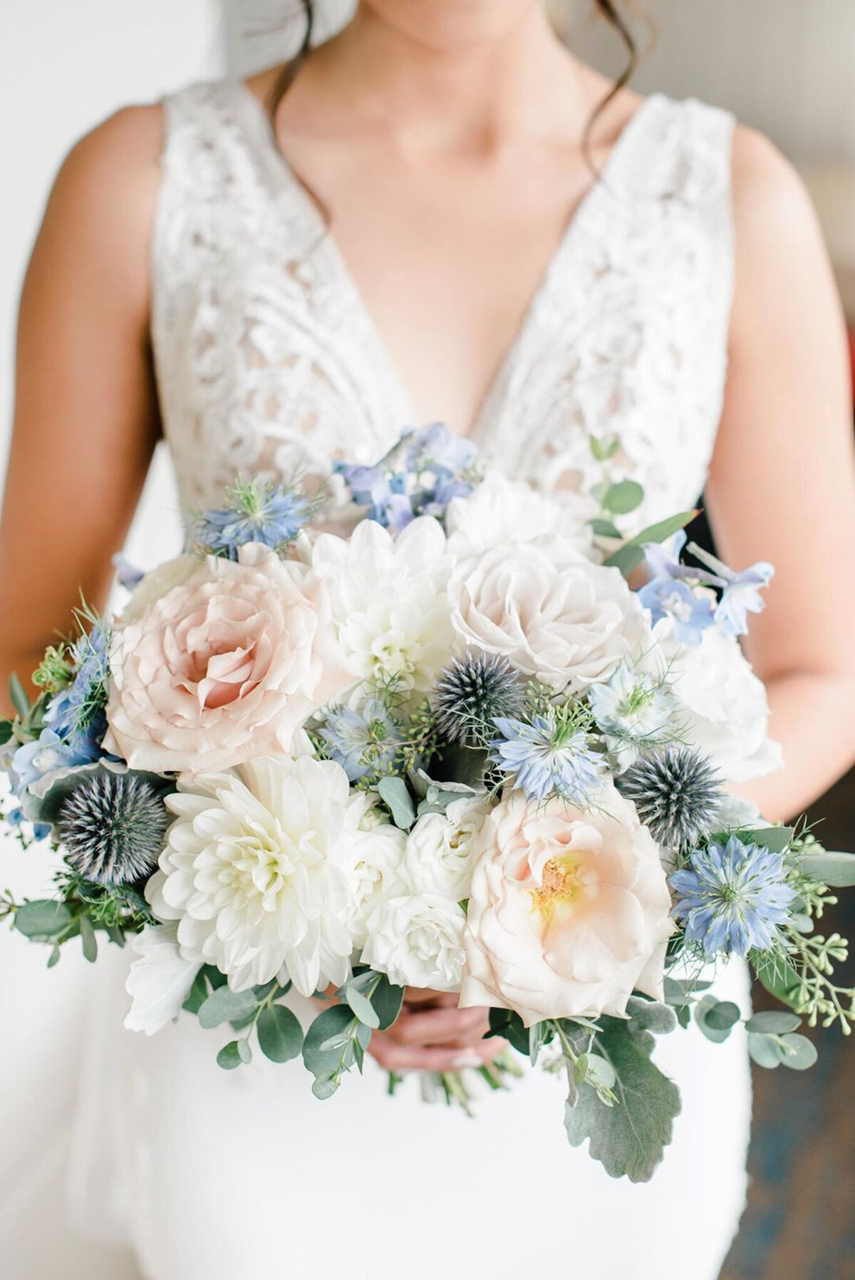 Classic bridal bouquet with pink, white and blue florals by Flowers By Janie, artful Calgary, Alberta wedding florist, featured on the Brontë Bride Vendor Guide.