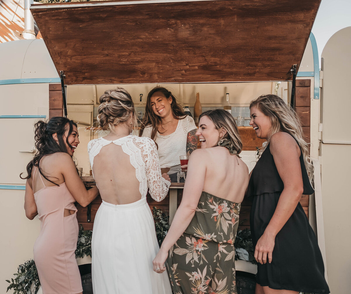 bartender serving a group of girls