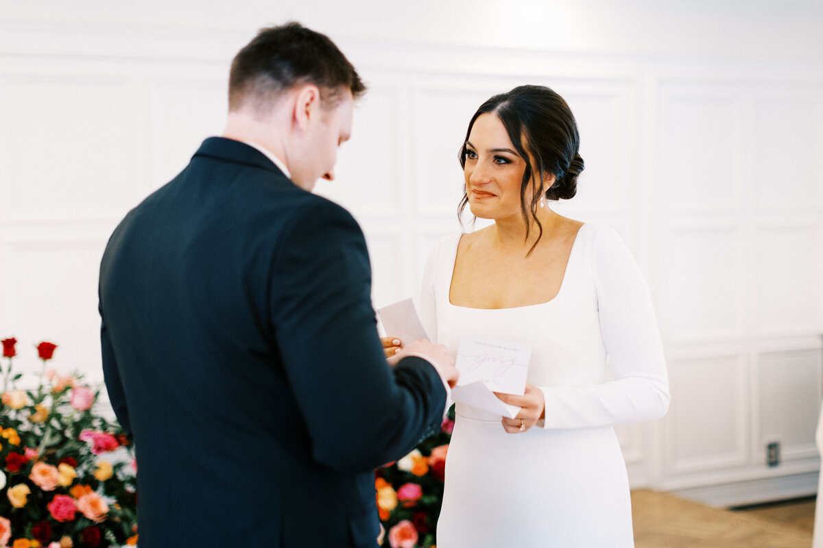 couple exchange written vows.