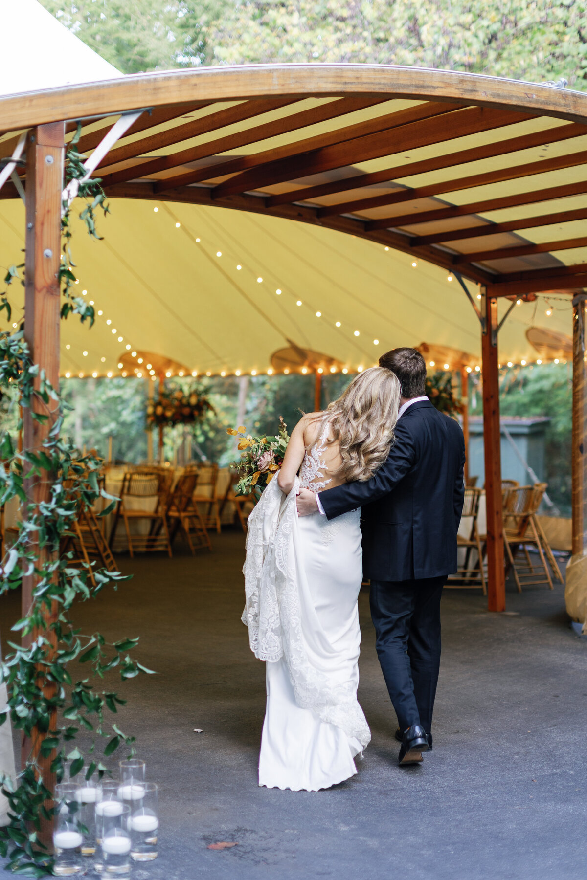 bride-and-groom-walking-into-sperry-tent