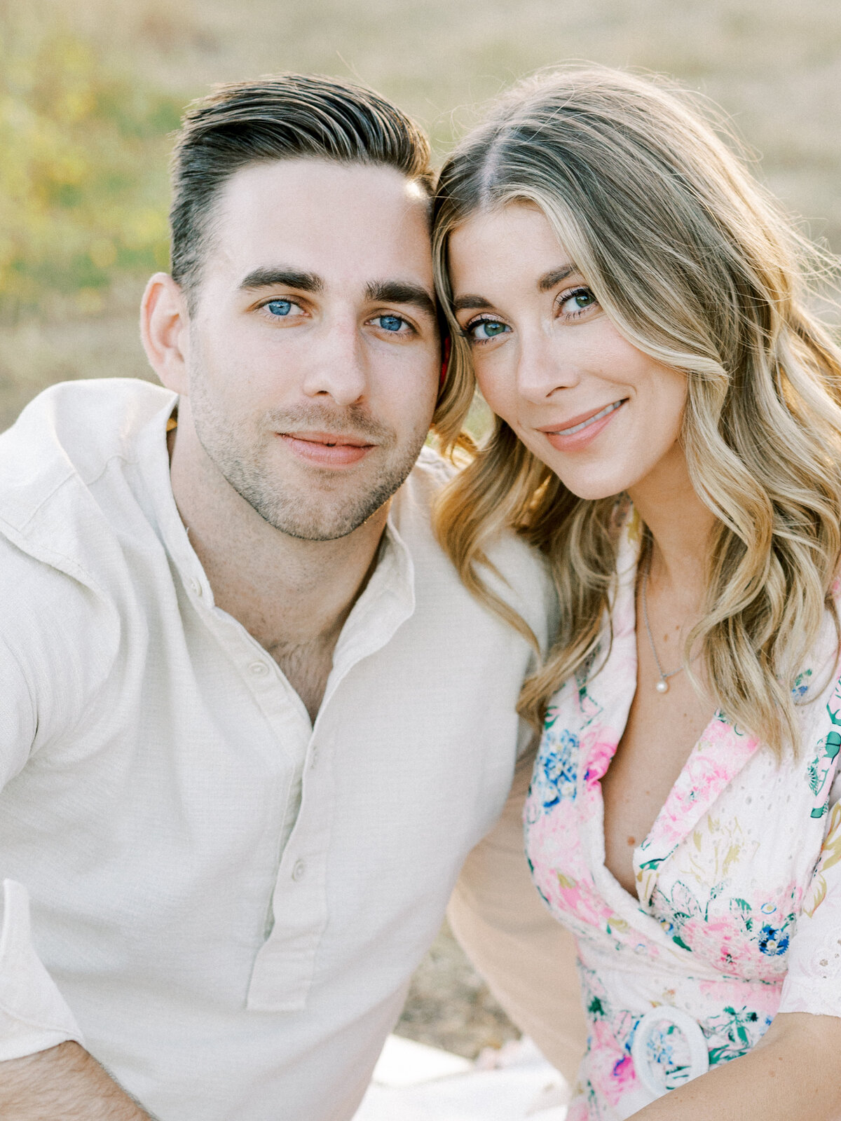 Soft and romantic close-up of an engaged couple—natural light, gentle smiles, and effortless connection.