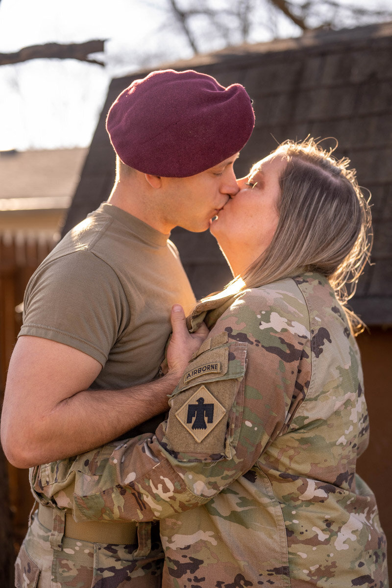 Army husband brings his wife in for a kiss
