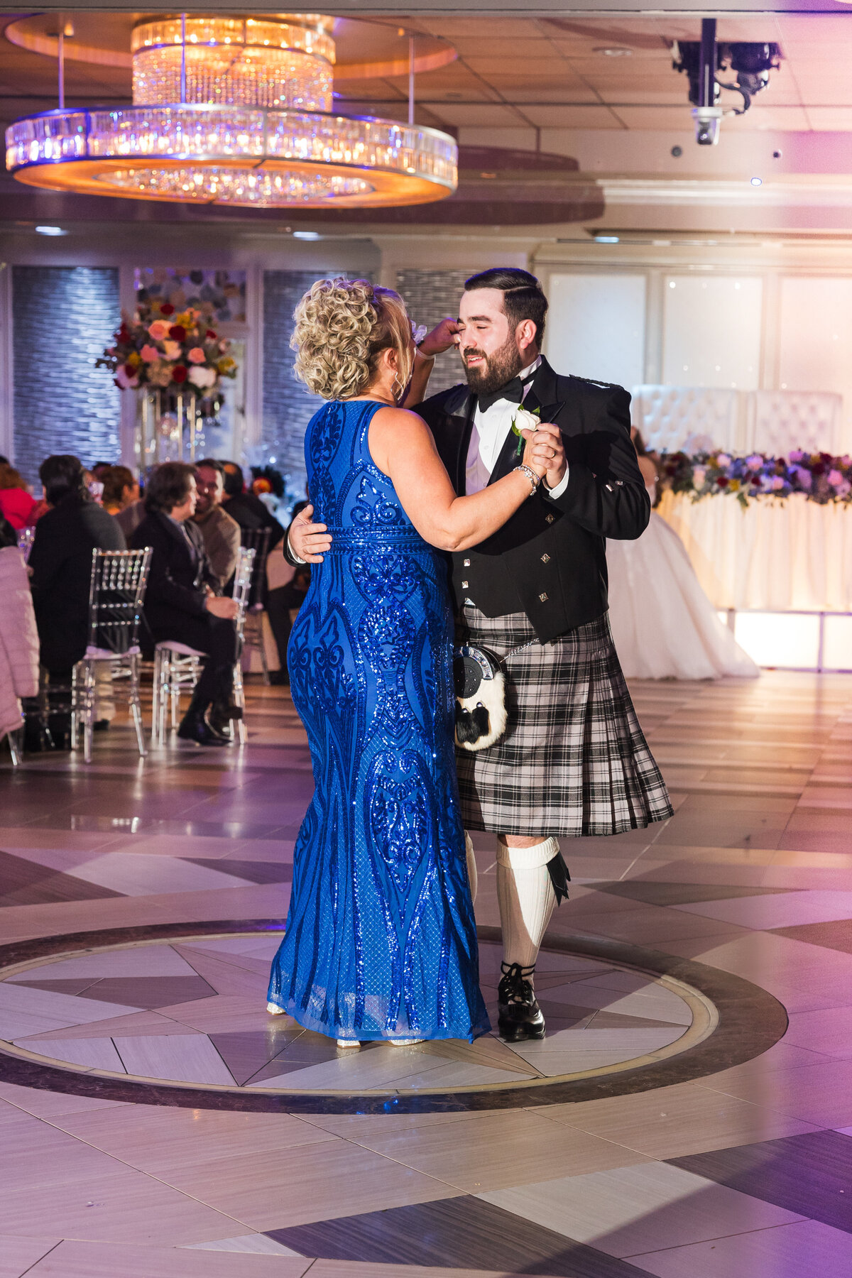 Son and Mom dance during wedding reception at  Russo's on the Bay.