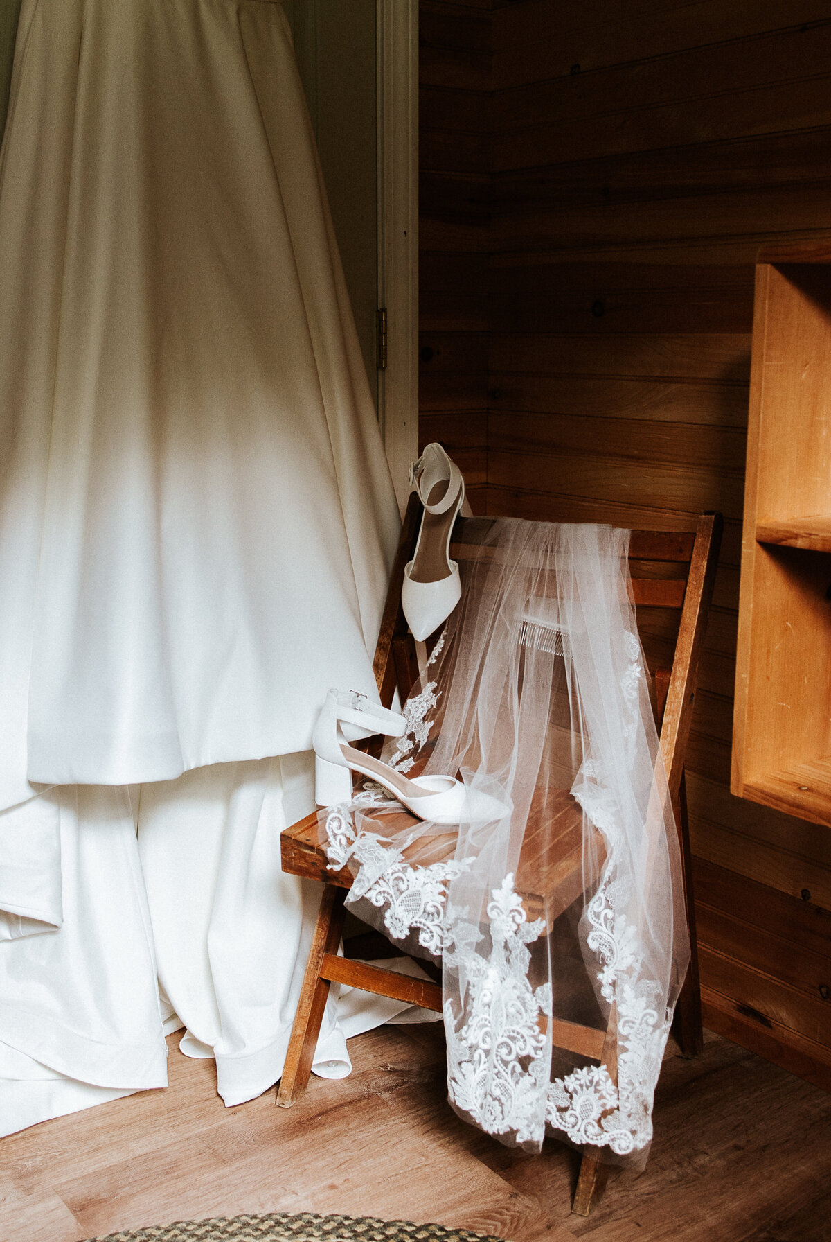 Detail photo of the brides dress, shoes and veil