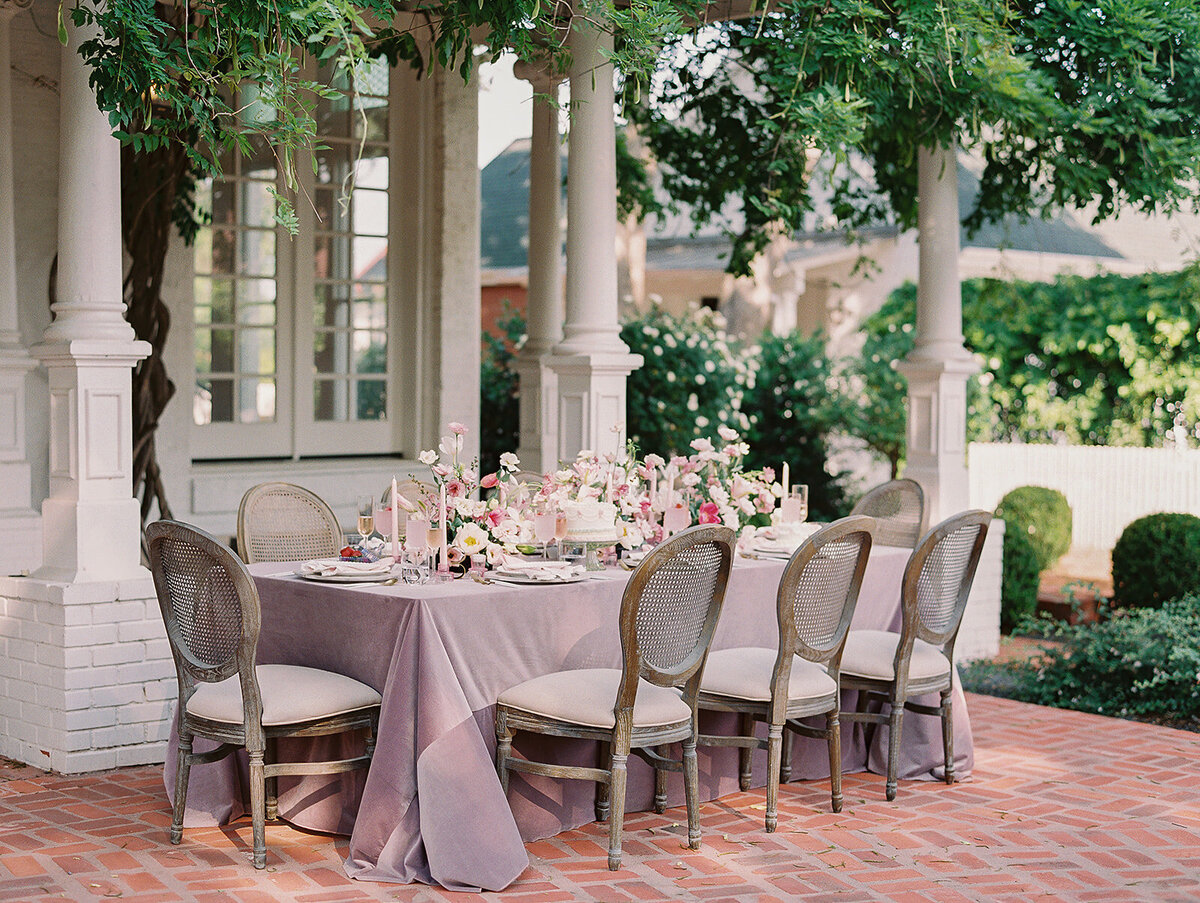 A spring themed tablescape set at Woodbine Mansion