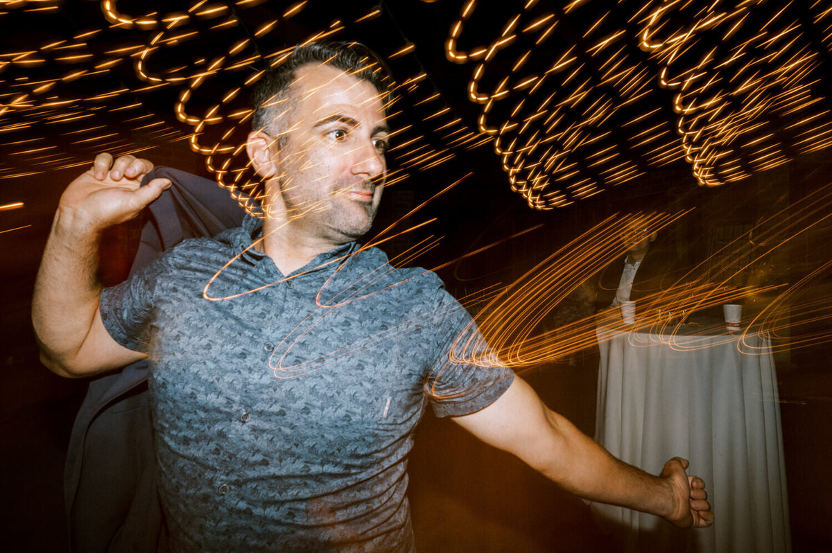 man-dancing-silly-with-shutter-drag