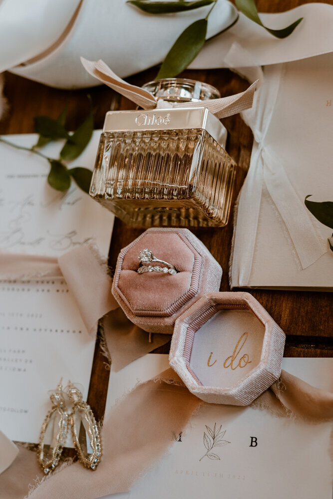 wedding-flat-lay-rings-perfume-details-ashton-hill-farm-cedar-rapids-iowa-storyteller-collective-photo-co