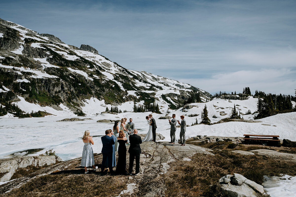 Couple has first kiss at Beverly Lake after Blackcomb Helicopters elopement ceremony