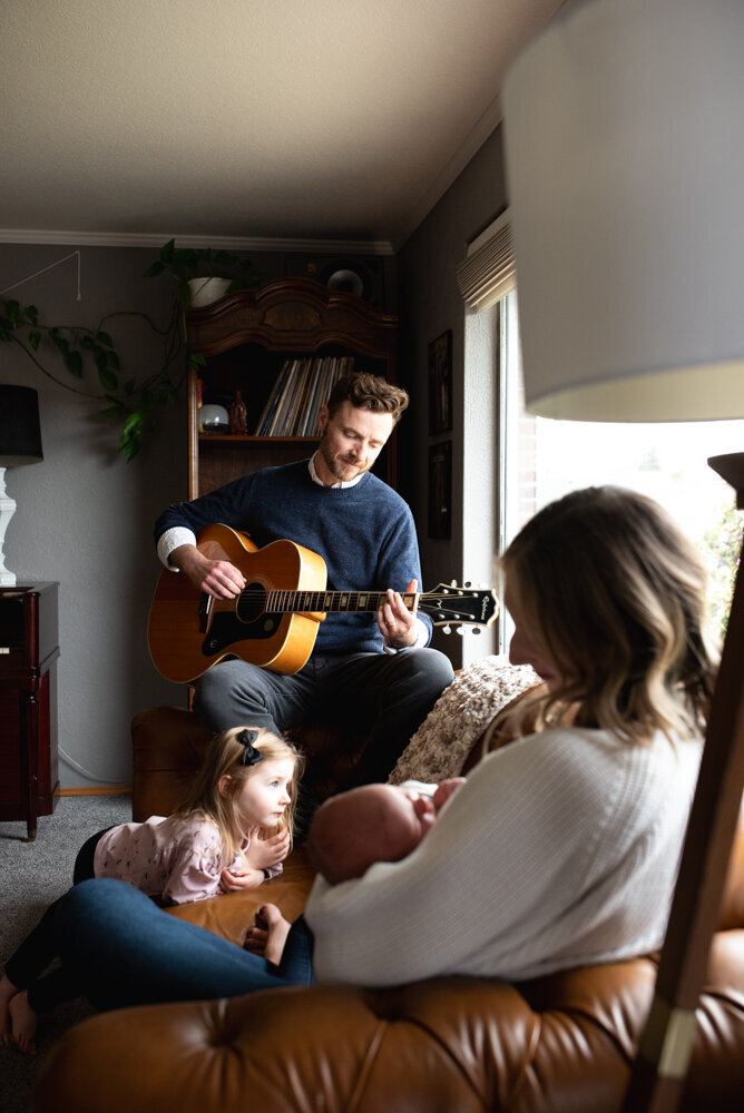 Music guitar playing for family newborn photos