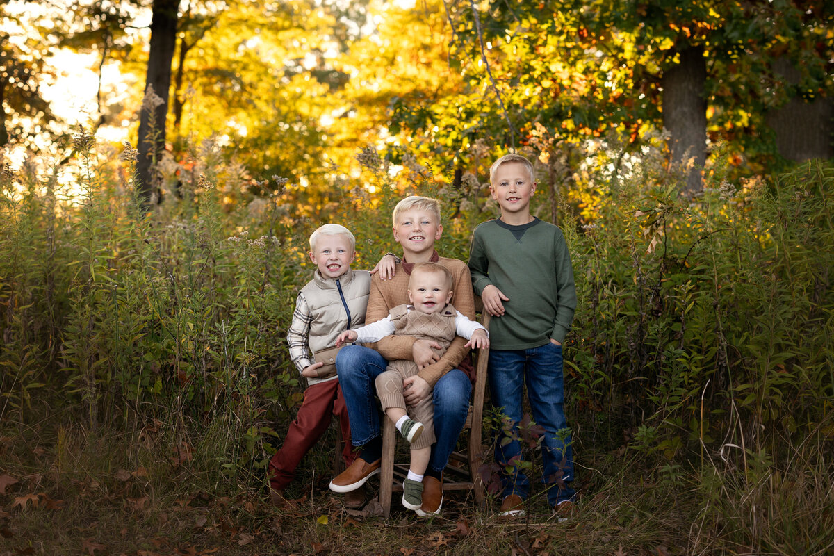 4 boys smiling for pictures in griffith indiana. photos done by brielle pausma photography