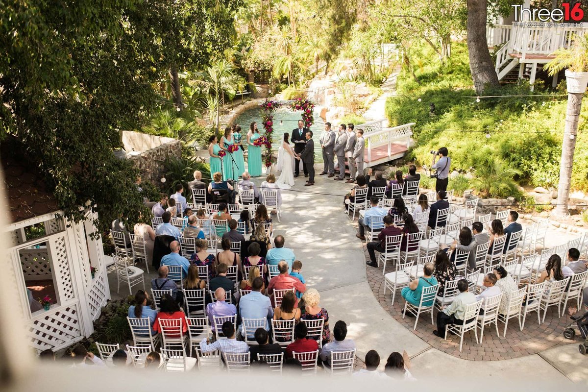 Aerial view of a  Jones Victorian Wedding Ceremony next to a pond