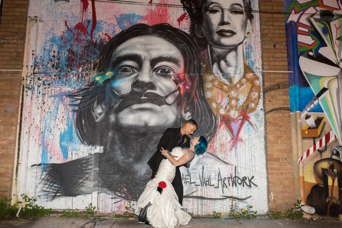 46 - Dali Museum St. Pete Wedding Alice in Wonderland Bride & Groom Mural - Tampa Bay Wedding Planner