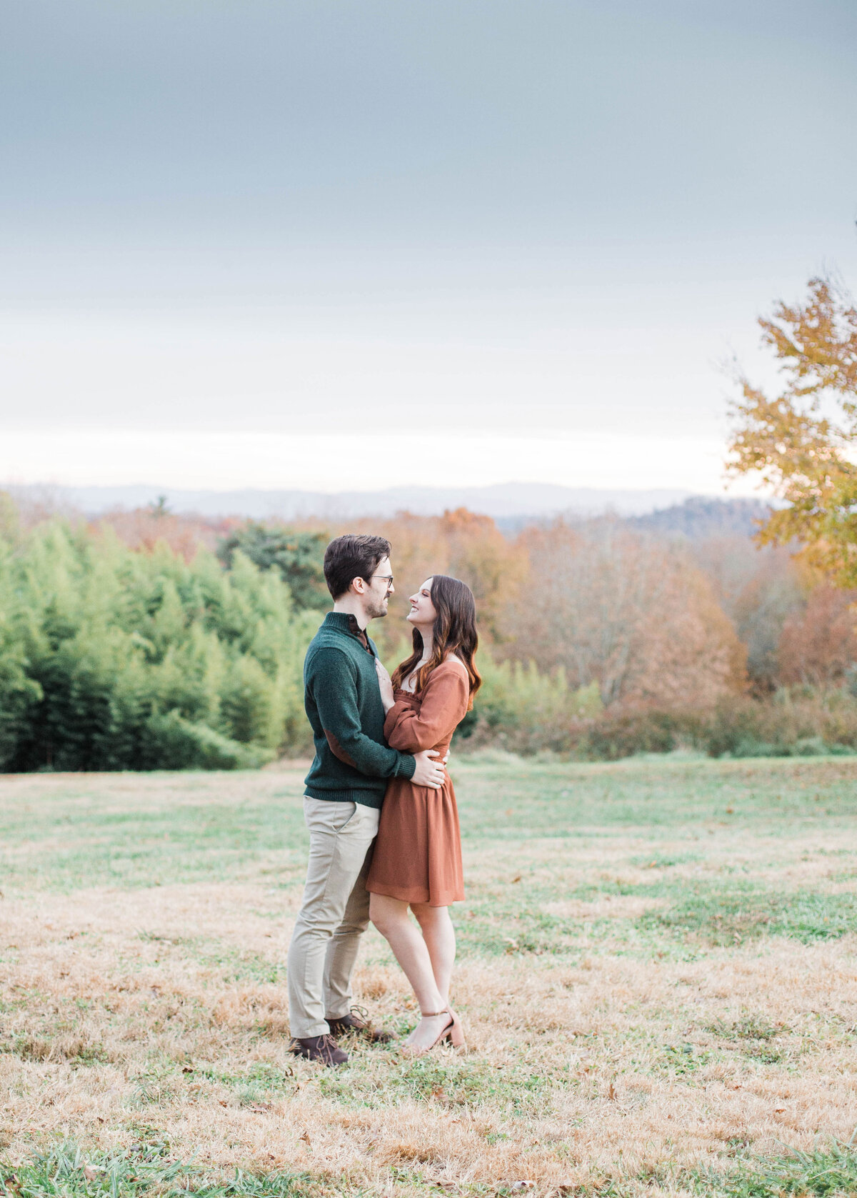 couple holding each other at fall session in Knoxville