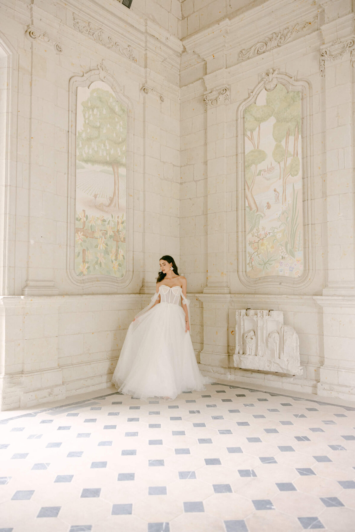 A wedding day photo of a bride in her white wedding dress at Chateau de Jalesnes in France