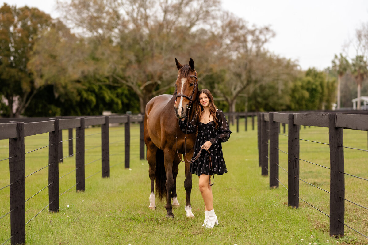 Horse photographer near Ocala, FL takes photos of junior rider and her horse for senior pictures.