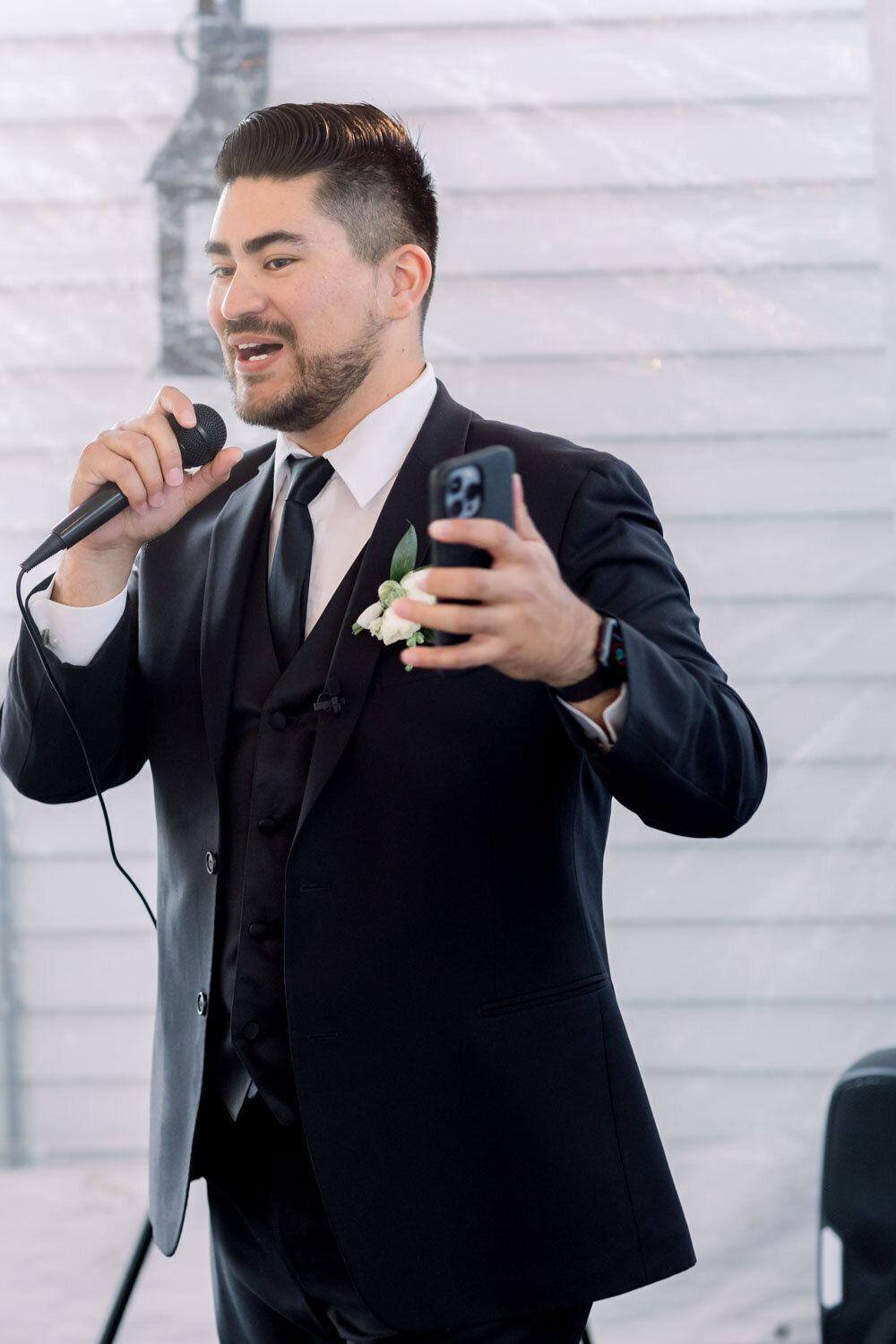 Man in suit talking during wedding ceremony