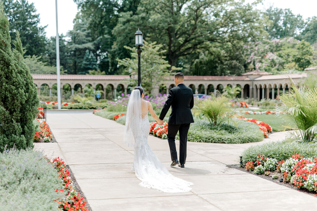 Bride and groom walking outdoors