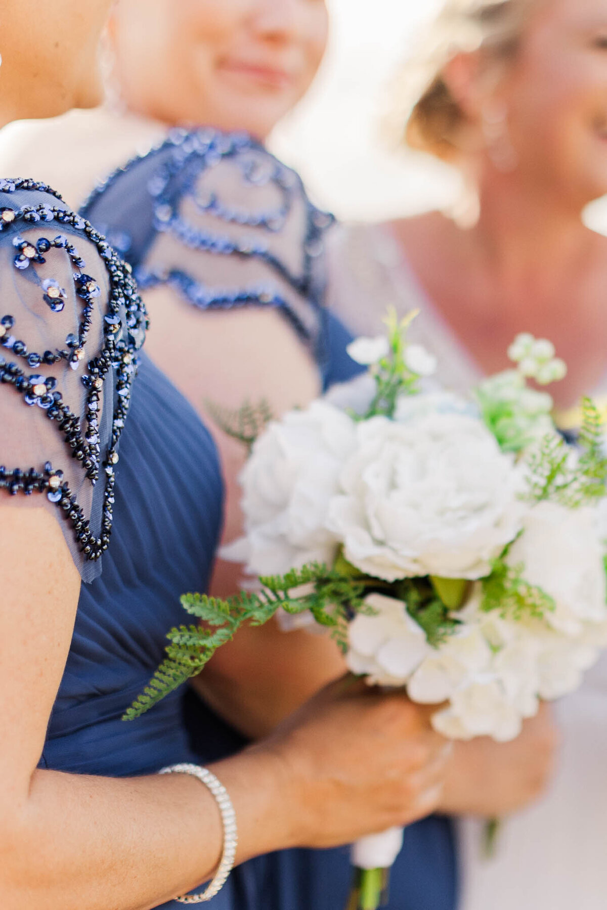 detailed photo of bridesmaids dress and flowers.