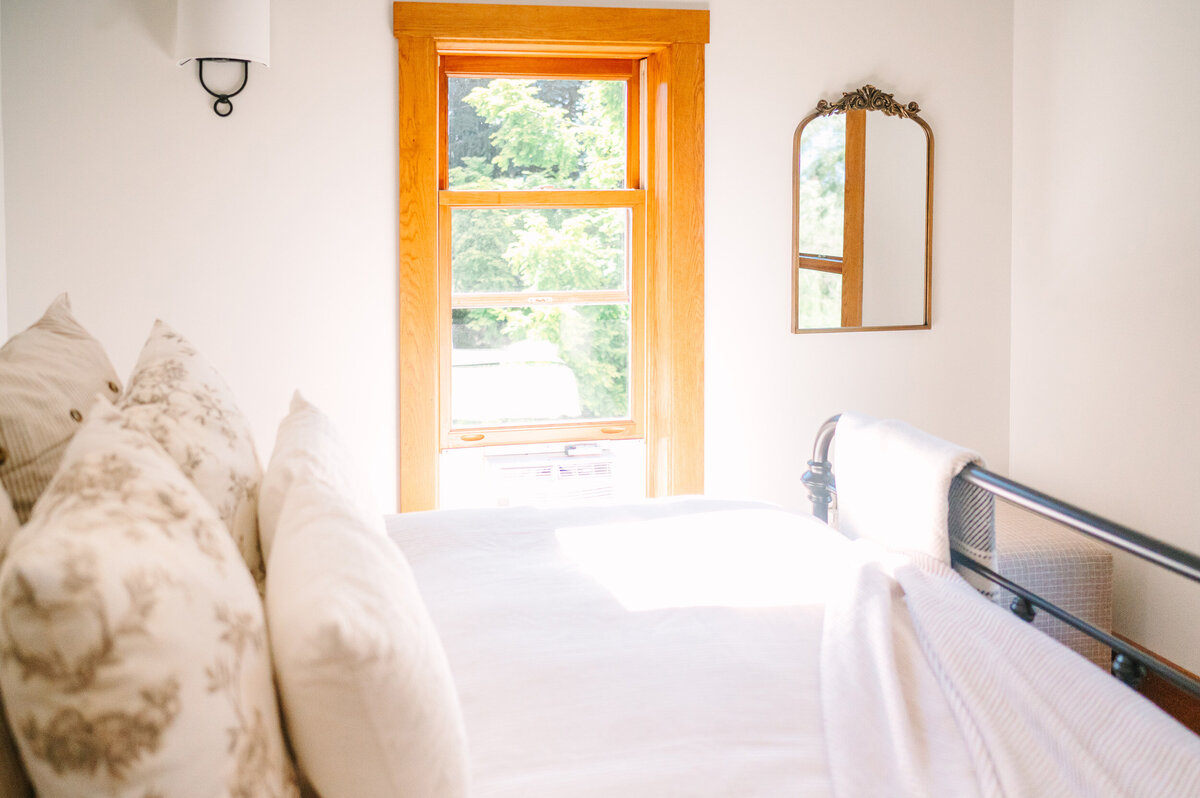 the gold bedroom in the modern farmhouse overnight accommodations at Willowbrook wedding venue