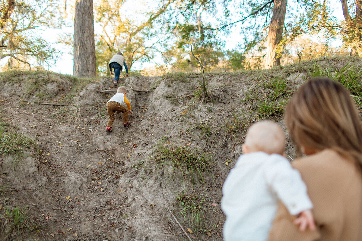 Family portrait taken outdoors, photographed by San Antonio family photographer Sara James.