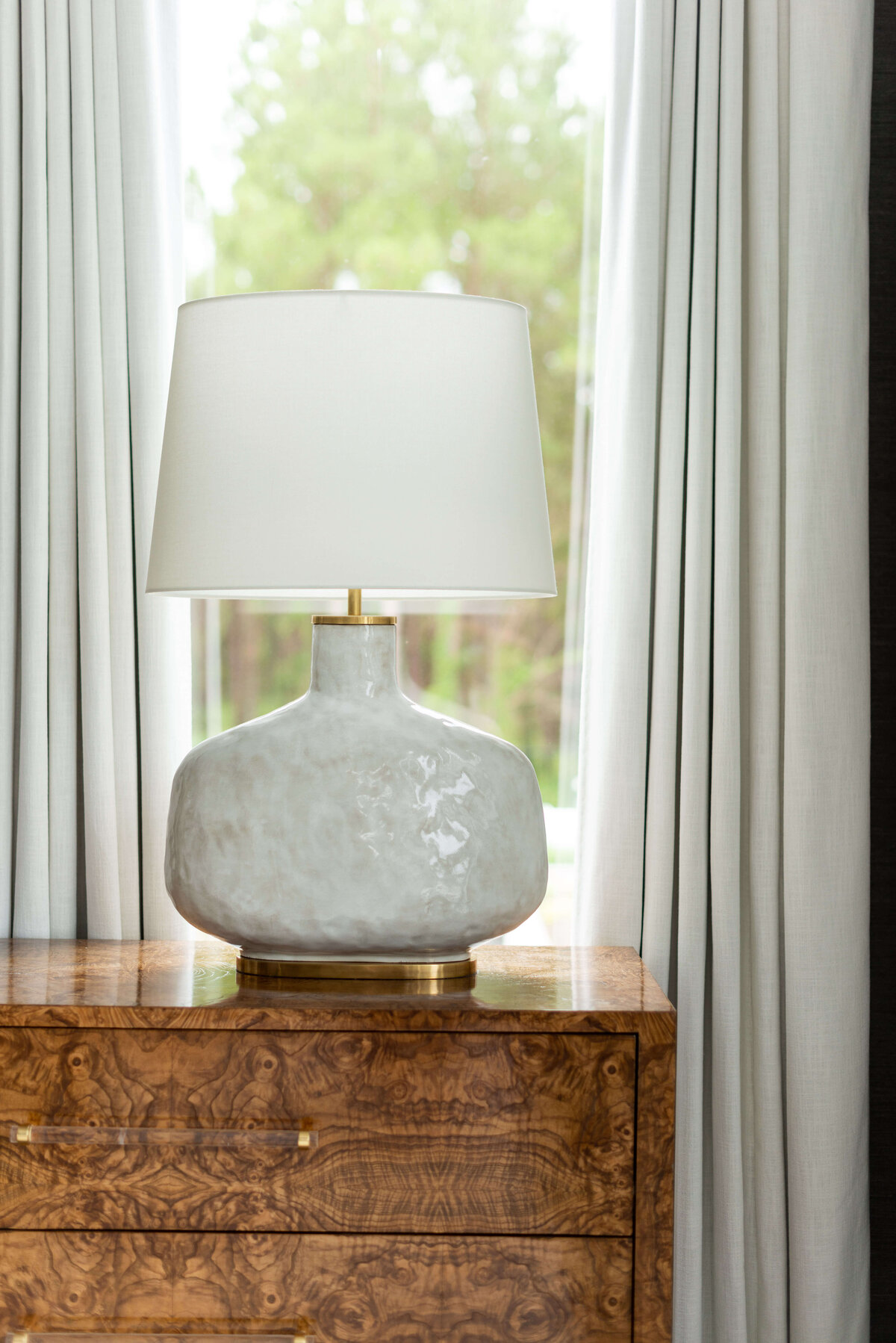 oyster creek studios building belt new build white lmap on wooden side table in bedroom
