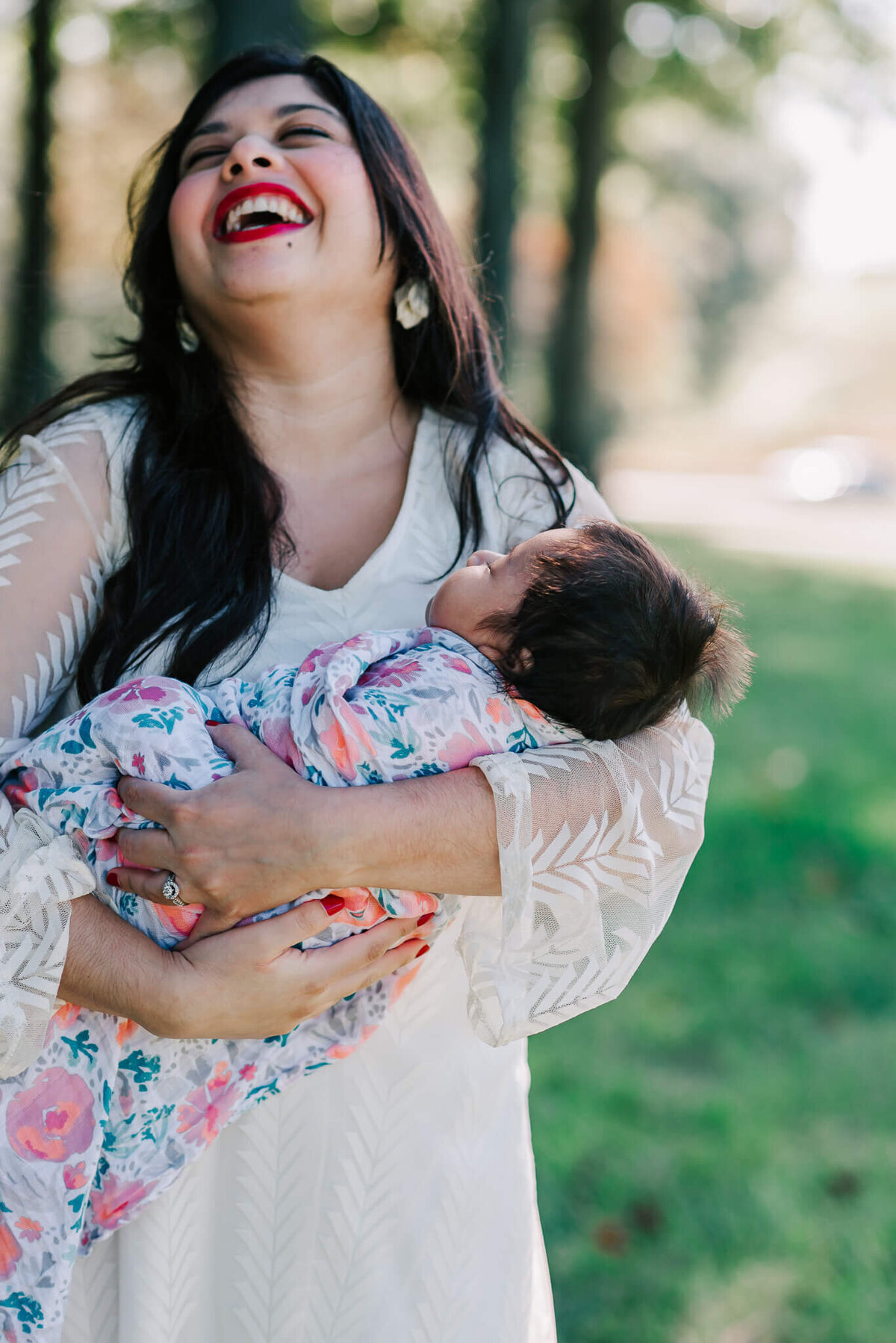 joyful moment of a mother with her baby daughter captured by Denise Van, a Northern VA newborn photographer