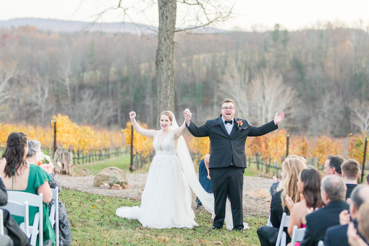 Happy married couple about to walk down the aisle