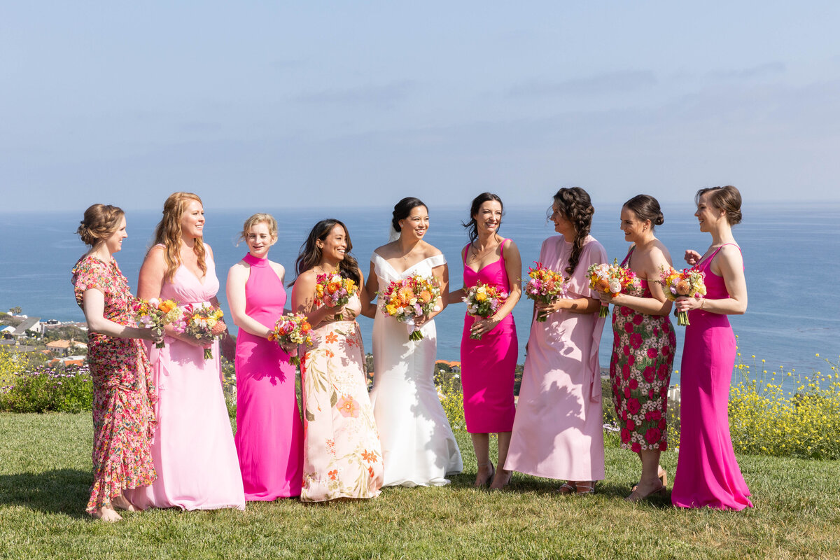 bride and bridal party wearing pink colors dresses